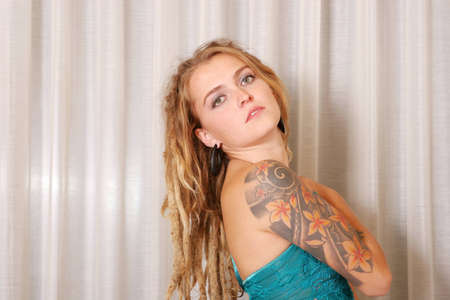 Young woman with tattoosの写真素材