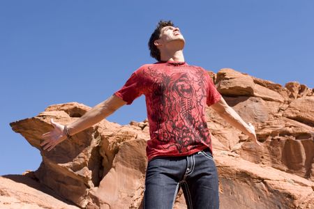 Sexy fashionable young man in jeans and shirtの写真素材