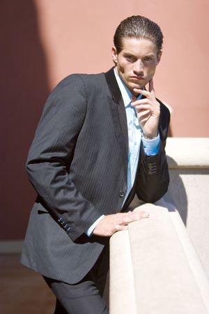 Handsome businessman in dark suitの写真素材