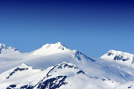 Snow covered beautiful mountain peaksの写真素材
