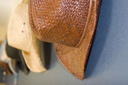 Cowboy hat hanging on the wallの写真素材