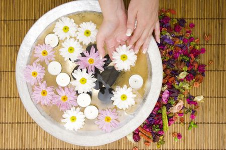 Woman dipping her hand in waterの写真素材