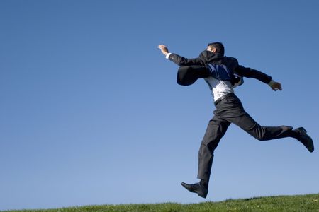 Businessman jumping in the airの写真素材