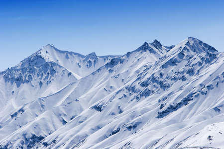 Snow covered beautiful mountain peaksの写真素材