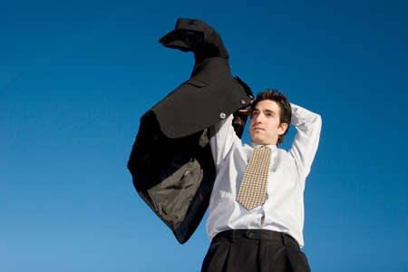 Businessman putting his jacket onの写真素材
