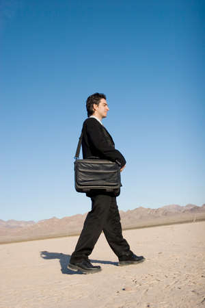 Businessman carrying his laptop caseの写真素材