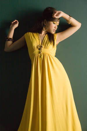 Pretty asian woman in yellow dressの写真素材