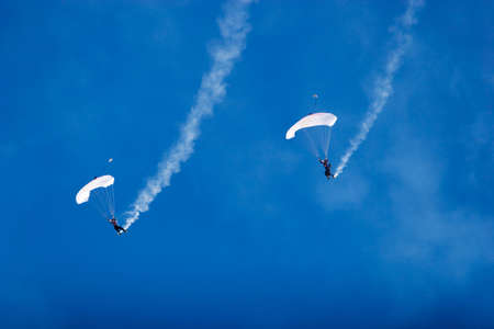Two professionals paragliding for airshowの写真素材