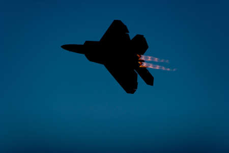 F-22 Raptor jet airplane silhouette during airshowの写真素材