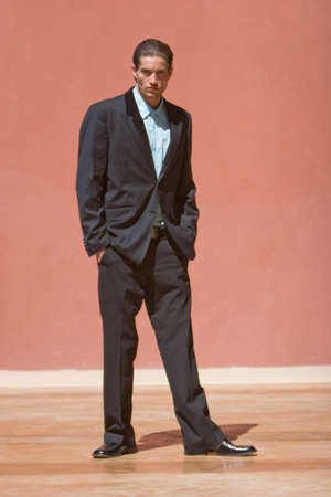 Handsome businessman in dark suitの写真素材