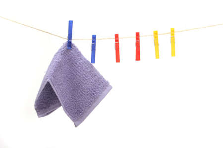 Purple color towel hanging on the rope