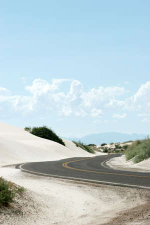 Curvy road in white sand dunesの写真素材
