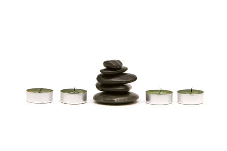 Spa stones and candles isolated on white backgroundの写真素材