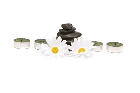 Spa stones and candles isolated on white backgroundの写真素材