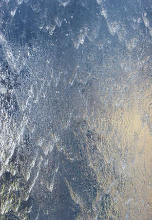 Water pouring over glassの写真素材