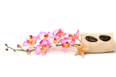 Spa towel, starfish, massage stones and pink orchidの写真素材