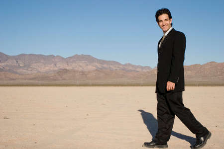 Businessman in drk suit walkingの写真素材