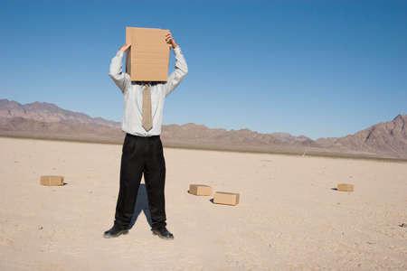 Man with a box over his headの写真素材