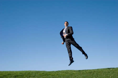 Businessman jumping in the airの写真素材