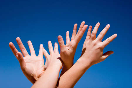 Group of people hands in the airの写真素材