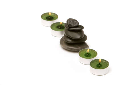Spa stones and candles isolated on white backgroundの写真素材