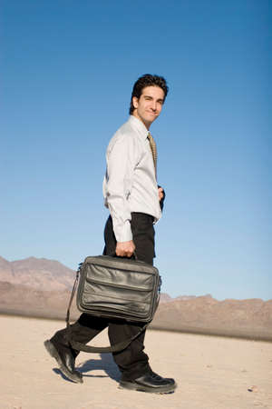 Businessman carrying his laptop caseの写真素材