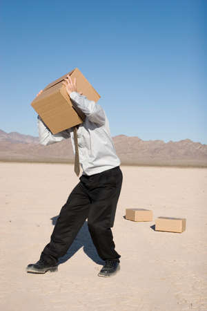 Man with a box over his headの写真素材