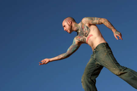Male model with tattoos on his bodyの写真素材
