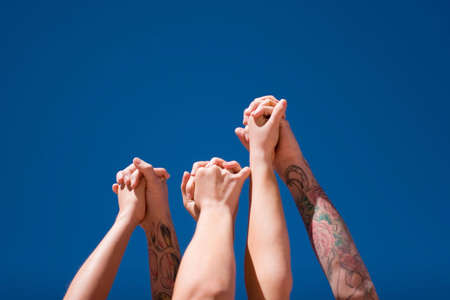 Group of people hands in the airの写真素材