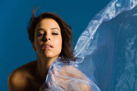 Beautiful woman wrapped in silkの写真素材