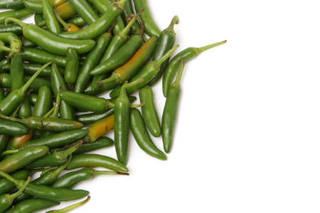 Green chili peppers on white background
