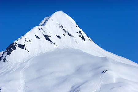 Snow covered beautiful mountain peaksの写真素材