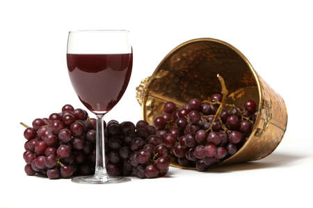 Red grapes and a glass of red wineの写真素材