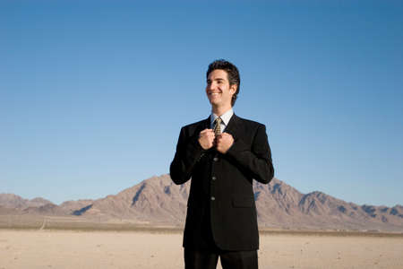 Smiling businessman in dark suitの写真素材