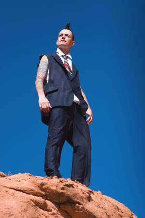 Man with mohawk style haircut and alternative fashion outfitの写真素材