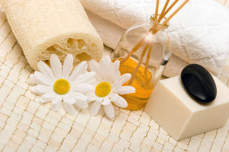 Spa towels, fragrance sticks, loofah and soapの写真素材
