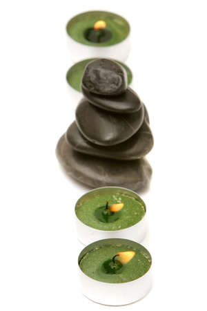 Spa stones and candles isolated on white backgroundの写真素材
