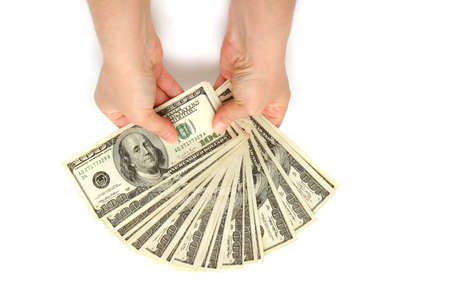 Businesswoman holding hundred dollar bills