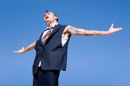 Man with mohawk style haircut and alternative fashion outfitの写真素材