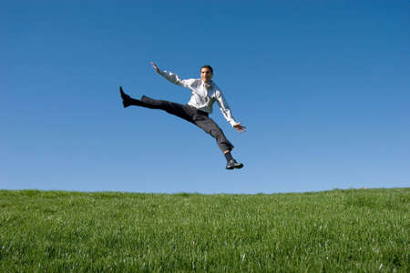 Businessman jumping in the airの写真素材