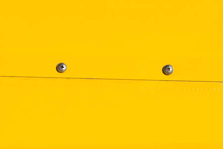 Yellow color painted aluminum backgroundの写真素材