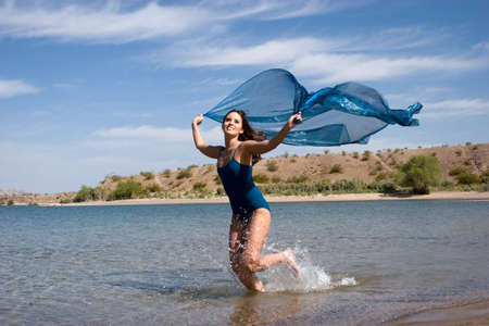Sexy young female enjoying the beachの写真素材