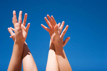 Group of people hands in the airの写真素材