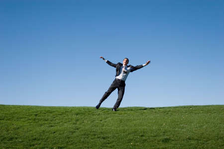 Businessman jumping in the air