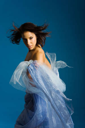 Beautiful woman wrapped in silkの写真素材