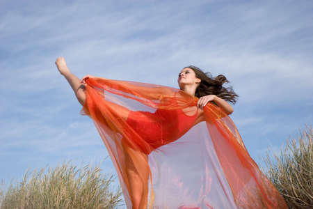 Gorgeous young woman exercising outdoorsの写真素材