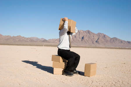Man with a box over his headの写真素材