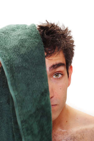 Man drying his hair with a towelの写真素材