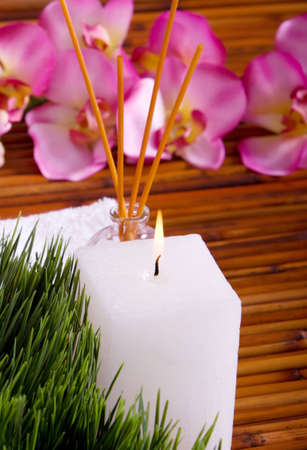 Spa towels, candle and orchidの写真素材