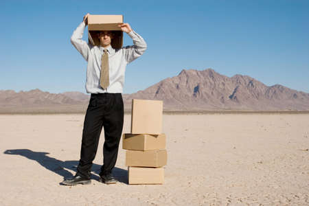 Man with a box over his headの写真素材